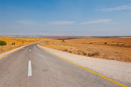 simsearch:400-06521455,k - Asphalt Road between Plowed Fields in Israel Fotografie stock - Microstock e Abbonamento, Codice: 400-06526648