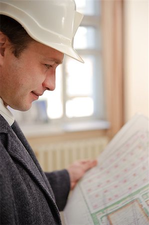 simsearch:400-04616755,k - Engineer or Architect with a hard hat looking at plans. Stock Photo - Budget Royalty-Free & Subscription, Code: 400-06526877