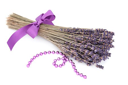 Lavender herb flower posy with lilac bead strand over white background. Lavandula. Stock Photo - Budget Royalty-Free & Subscription, Code: 400-06527801