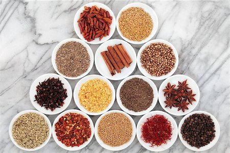 simsearch:400-06365740,k - Large herb and spice selection in white bowls over marble background. Stockbilder - Microstock & Abonnement, Bildnummer: 400-06527920