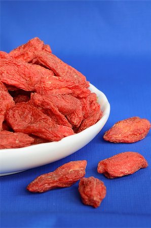 simsearch:400-07545974,k - Goji berries also called wolfberries isolated on blue Stock Photo - Budget Royalty-Free & Subscription, Code: 400-06528093