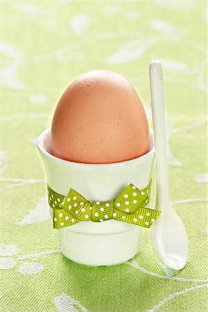 simsearch:400-08338441,k - Egg in egg cup for breakfast on green napkin. Stockbilder - Microstock & Abonnement, Bildnummer: 400-06528587