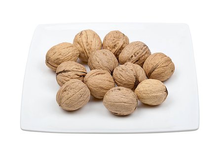 simsearch:400-06520688,k - Plate of walnuts isolated on white background Stock Photo - Budget Royalty-Free & Subscription, Code: 400-06528581