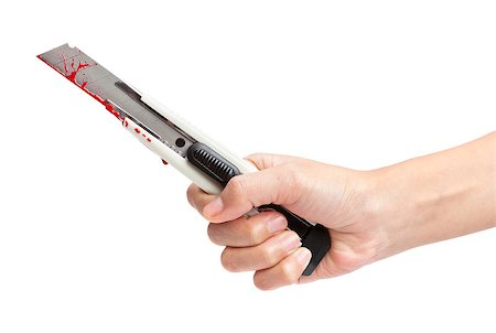 A hand holding a blood covered boxcutter isolated on a white background. Stock Photo - Budget Royalty-Free & Subscription, Code: 400-06528734