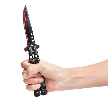 simsearch:693-03363711,k - A hand holding a blood covered butterfly knife isolated on a white background. Stockbilder - Microstock & Abonnement, Bildnummer: 400-06528737