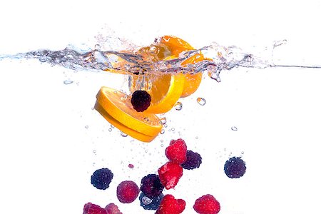 Fresh Fruit Falls under Water with a Splash, isolated Stock Photo - Budget Royalty-Free & Subscription, Code: 400-06529091