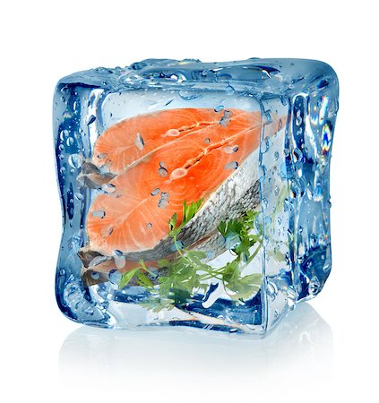 Ice cube and fish with parsley isolated on a white background Photographie de stock - Aubaine LD & Abonnement, Code: 400-06529999