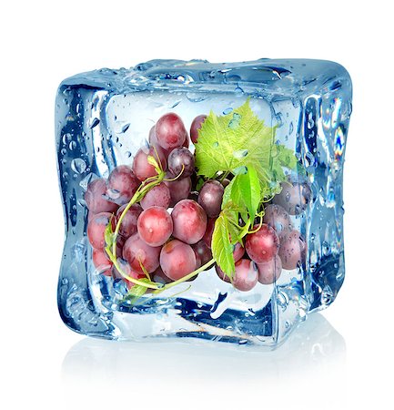 fresh glass of ice water - Ice cube and blue grapes isolated on a white background Stock Photo - Budget Royalty-Free & Subscription, Code: 400-06529992