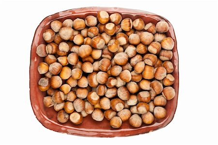 simsearch:400-06520688,k - Plate of hazelnuts isolated on white background Stock Photo - Budget Royalty-Free & Subscription, Code: 400-06520683