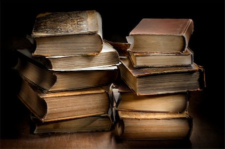 Dark and moody photograph od two stacks of old worn antique books. Stock Photo - Budget Royalty-Free & Subscription, Code: 400-06521129