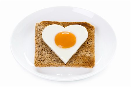 heart shaped cooked egg on toast isolated on white background Stock Photo - Budget Royalty-Free & Subscription, Code: 400-06521980