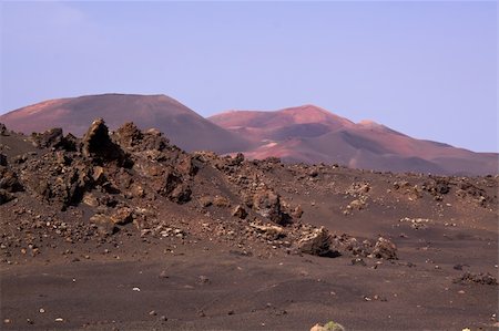 Barren land in Timanfaya national park on volcanic island Lanzarote, Canary Islands Photographie de stock - Aubaine LD & Abonnement, Code: 400-06522128