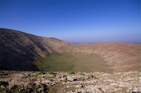 Huge crater in Volcanic park Timanfaya on island Lanzarote, Canary Islands Photographie de stock - Aubaine LD & Abonnement, Code: 400-06522133