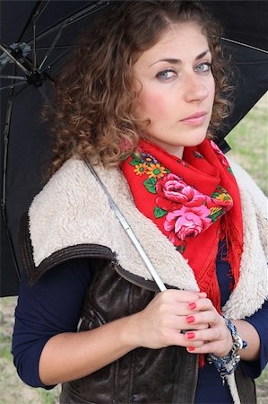 Beautiful curly hair woman with an umbrella Foto de stock - Super Valor sin royalties y Suscripción, Código: 400-06522292