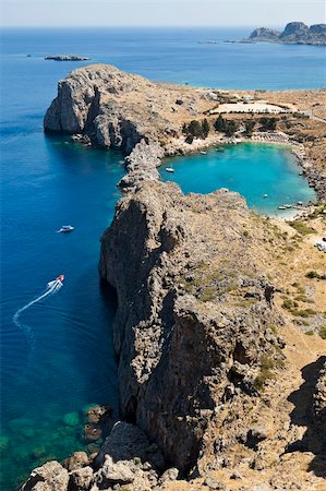 A blue lagoon near the town of Lindos on the Greek island of Rhodos highlights the deep blue waters. Stock Photo - Budget Royalty-Free & Subscription, Code: 400-06522316