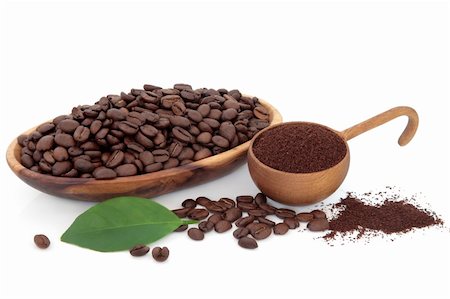 Coffee beans ground and whole with leaf sprig over white background. Stock Photo - Budget Royalty-Free & Subscription, Code: 400-06522344