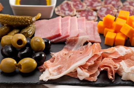 plate of cold cuts and cheeses - assorted fresh cold cut platter Italian appetizer Stock Photo - Budget Royalty-Free & Subscription, Code: 400-06522382