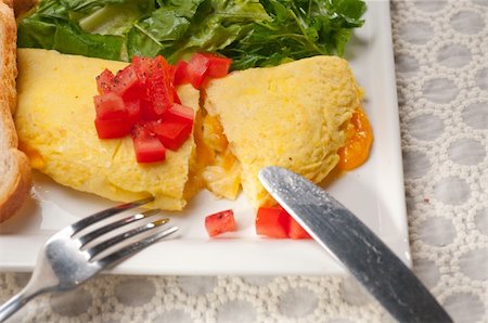 home made omelette with cheese tomato and rucola rocket salad arugola Stock Photo - Budget Royalty-Free & Subscription, Code: 400-06522493