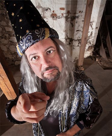 Middle aged serious European male wizard pointing Stock Photo - Budget Royalty-Free & Subscription, Code: 400-06522833