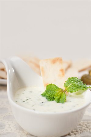 fresh Greek Tzatziki yogurt dip and pita bread and pickels Stock Photo - Budget Royalty-Free & Subscription, Code: 400-06530307