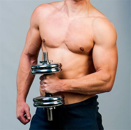 picture back muscles human body - attractive athletic male torso with dumbbells in hand Stock Photo - Budget Royalty-Free & Subscription, Code: 400-06530357