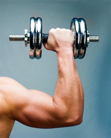 Arm attractive athletic man with dumbbells Stock Photo - Budget Royalty-Free & Subscription, Code: 400-06530361