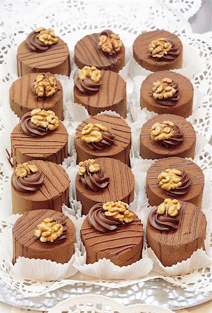Closeup of many chocolate cakes with walnut Stock Photo - Budget Royalty-Free & Subscription, Code: 400-06530690