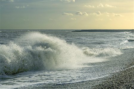 Wave crashing on a windswept shingle beach Stock Photo - Budget Royalty-Free & Subscription, Code: 400-06530890
