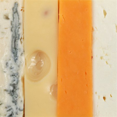 emmentaler cheese - Four different types of cheese such as Leerdammer, Cheddar and Gorgonzola forming a background Stock Photo - Budget Royalty-Free & Subscription, Code: 400-06554638