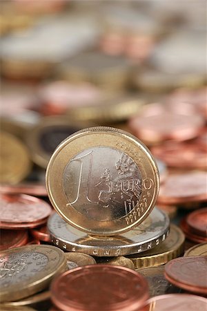 One Euro coin on Euro coins, plenty of copyspace Stock Photo - Budget Royalty-Free & Subscription, Code: 400-06554650