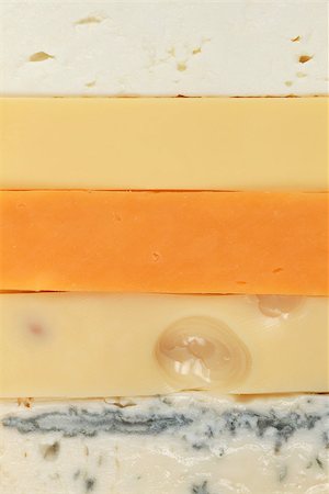 emmentaler cheese - Different types of cheese such as Gouda, Cheddar and Gorgonzola forming a background Stock Photo - Budget Royalty-Free & Subscription, Code: 400-06554708