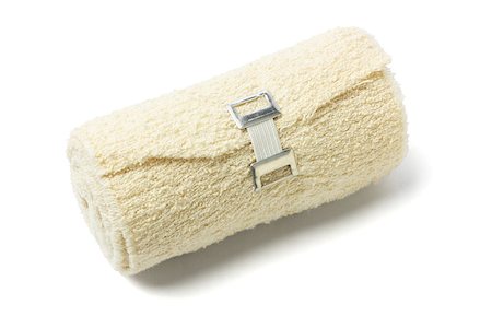 Roll of Elastic Crepe Bandage Lying on White Background Photographie de stock - Aubaine LD & Abonnement, Code: 400-06554748