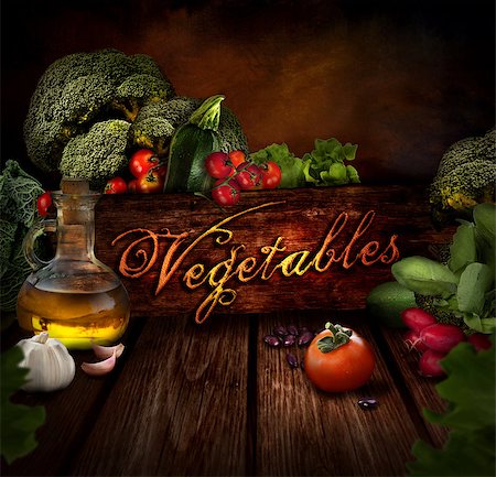 Food design - Fresh vegetables. Wooden background with olive oil, beans, garlic, tomatoes, cabbage, broccoli, radish and lettuce salad. Stock Photo - Budget Royalty-Free & Subscription, Code: 400-06555209