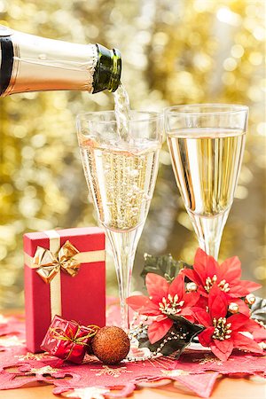Two glasses of champagne and gold background. Stock Photo - Budget Royalty-Free & Subscription, Code: 400-06555342