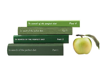 A stack of books shades of green, stacked in a ladder with the inscription "In search of the perfect diet" next to the green apple Stock Photo - Budget Royalty-Free & Subscription, Code: 400-06555915