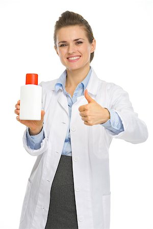 Smiling cosmetologist with bottle of sunscreen showing thumbs up Stock Photo - Budget Royalty-Free & Subscription, Code: 400-06556186