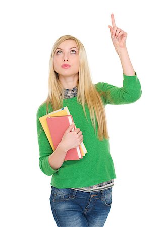 Happy student girl with books pointing up on copy space Stock Photo - Budget Royalty-Free & Subscription, Code: 400-06556203