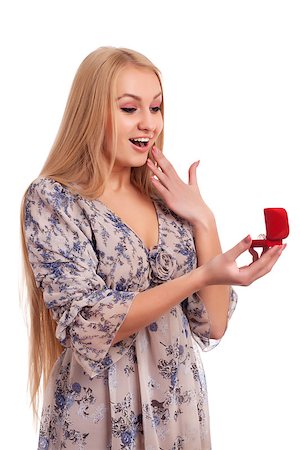 Surprised woman looking at engagement ring in a box Stock Photo - Budget Royalty-Free & Subscription, Code: 400-06556245