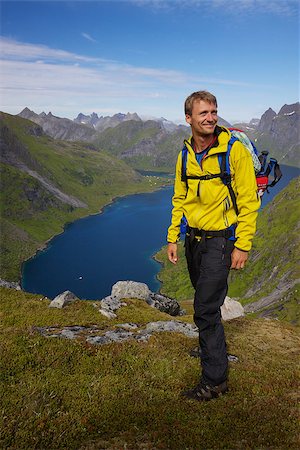 Young active man with backpack hiking on Lofoten islands in Norway on sunny day Stock Photo - Budget Royalty-Free & Subscription, Code: 400-06556354