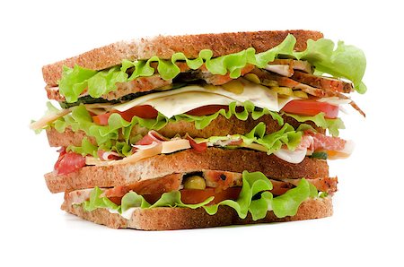 paine grande - Big Tasty Sandwich with Turkey Meat, Bacon, Cheese, Tomato, Marinated  Gherkins and Lettuce on Whole Wheat Bread closeup isolated on white background Photographie de stock - Aubaine LD & Abonnement, Code: 400-06556417