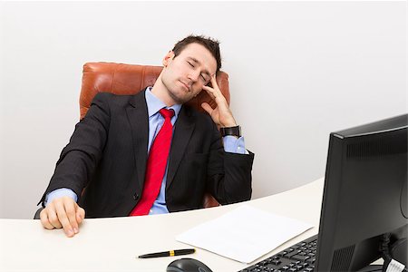 executive sleeping desk - Tired businessman sleeping in his office chair at work. Stock Photo - Budget Royalty-Free & Subscription, Code: 400-06556951