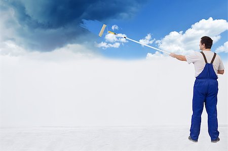 Worker painting the wall from stormy sky to fluffy clouds - with copy space Stock Photo - Budget Royalty-Free & Subscription, Code: 400-06557432