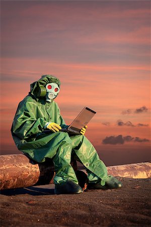 A man in protective suit works in the area of chemical contamination Stock Photo - Budget Royalty-Free & Subscription, Code: 400-06557489