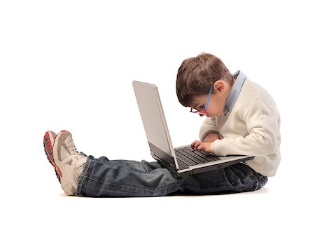 simsearch:400-06557512,k - Child concentrated on a laptop Photographie de stock - Aubaine LD & Abonnement, Code: 400-06557514