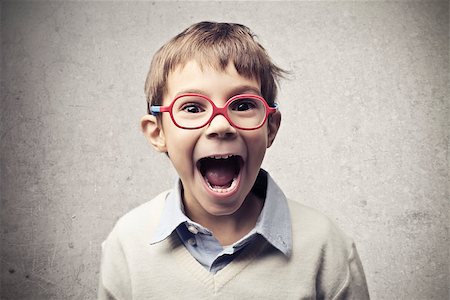 Child with red glasses shouting Stock Photo - Budget Royalty-Free & Subscription, Code: 400-06557517