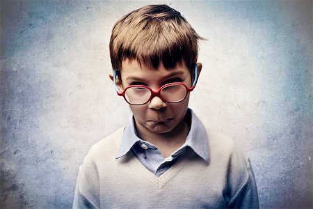Angry child with red glasses Stock Photo - Budget Royalty-Free & Subscription, Code: 400-06557536