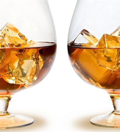 Glass of Whiskey with ice on white background Stockbilder - Microstock & Abonnement, Bildnummer: 400-06557680