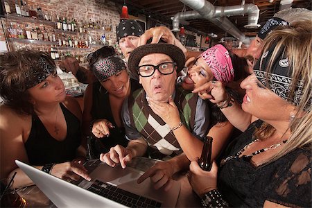 simsearch:400-06558607,k - Pretty biker gang women adoring nervous male nerd in bar Stock Photo - Budget Royalty-Free & Subscription, Code: 400-06557765