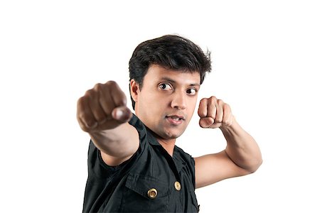 Angry Indian man in attacking position in extreme rage over white background Stock Photo - Budget Royalty-Free & Subscription, Code: 400-06557796