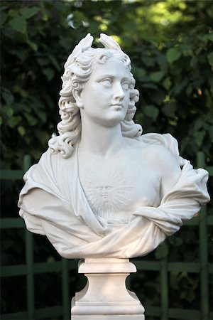 period style - Antique statue  allegory of the "day"  (Roman mythology). Situated in Summer Garden in St. Petersburg, Russia Stock Photo - Budget Royalty-Free & Subscription, Code: 400-06557791
